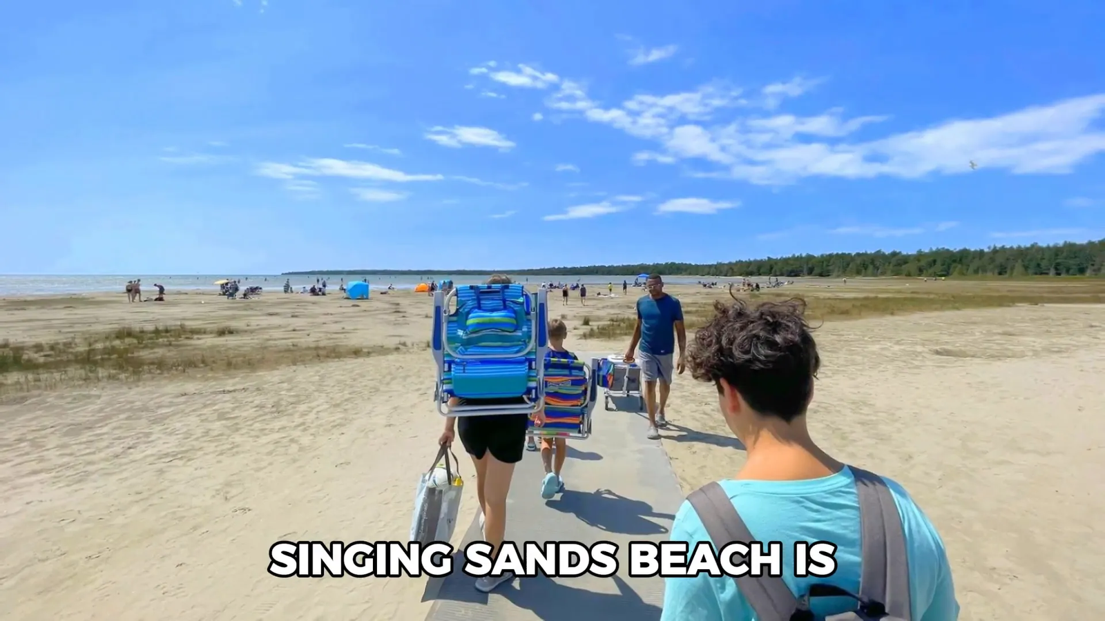 Singing Sands Beach with shallow waters and boardwalk