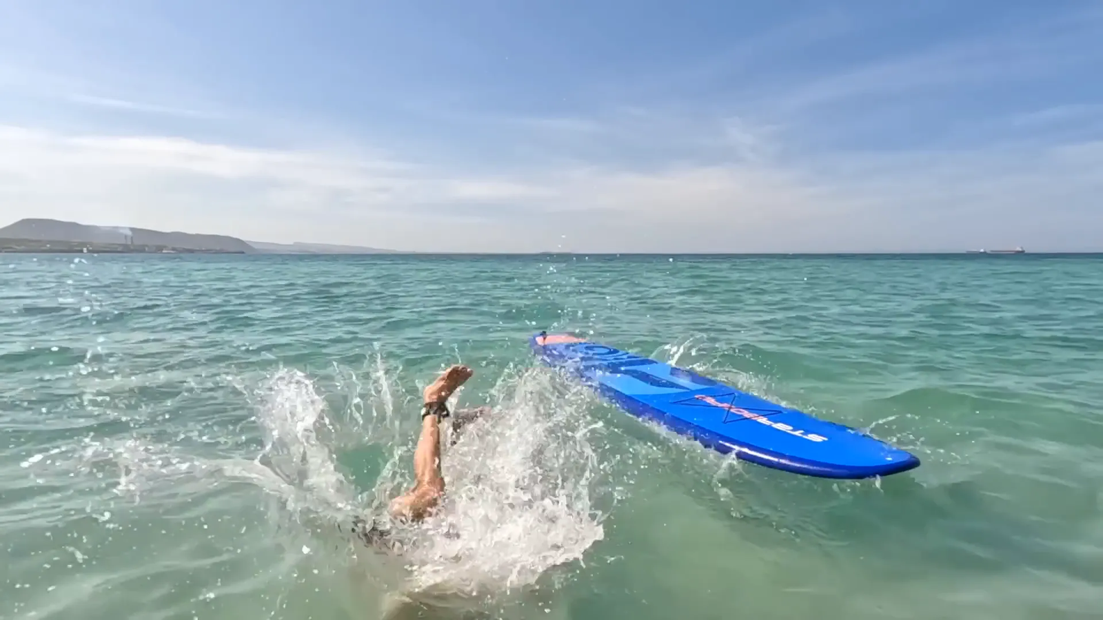 Close-up of paddle board leash attached to ankle