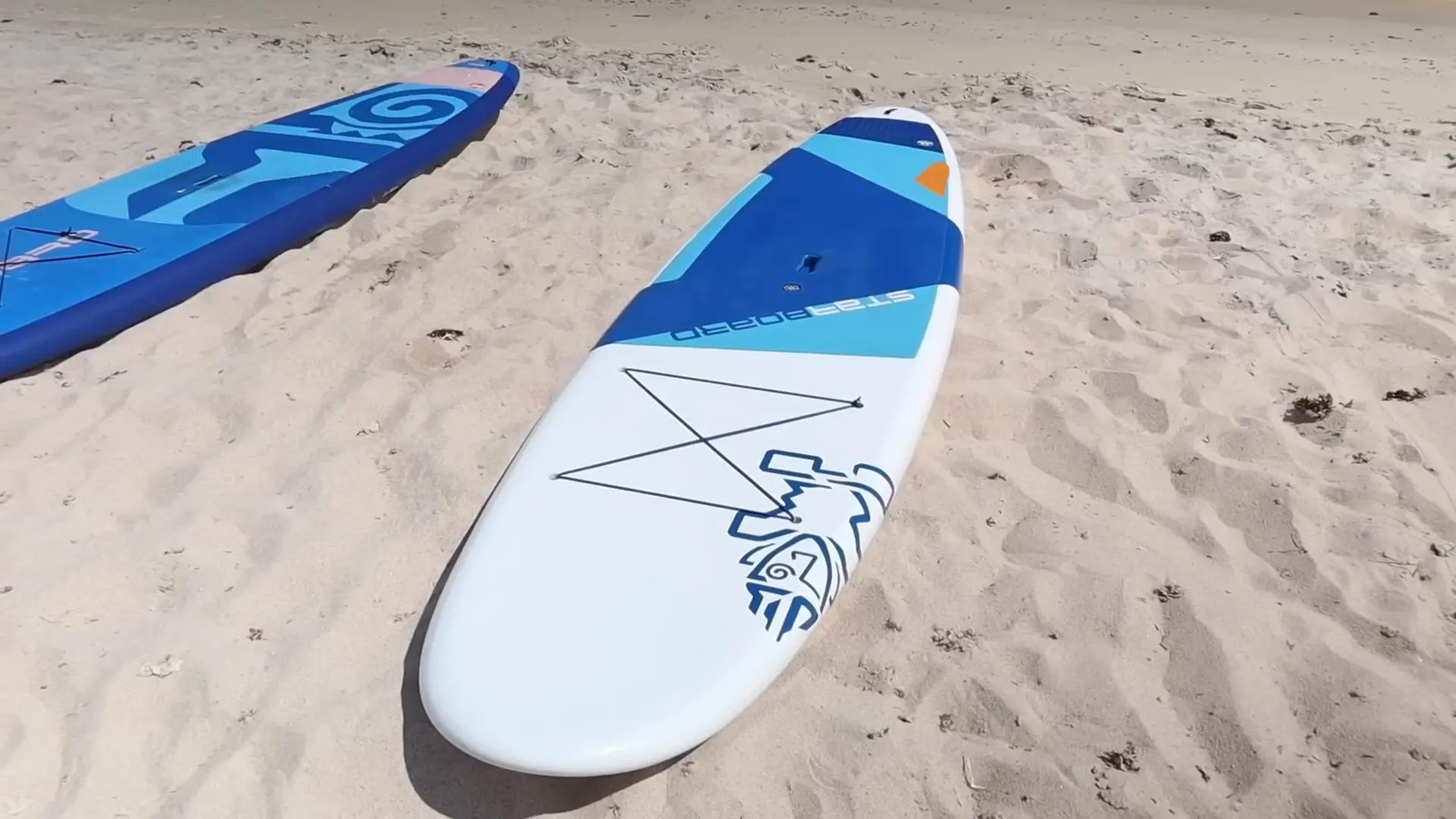 Wide all-around paddle board on calm water