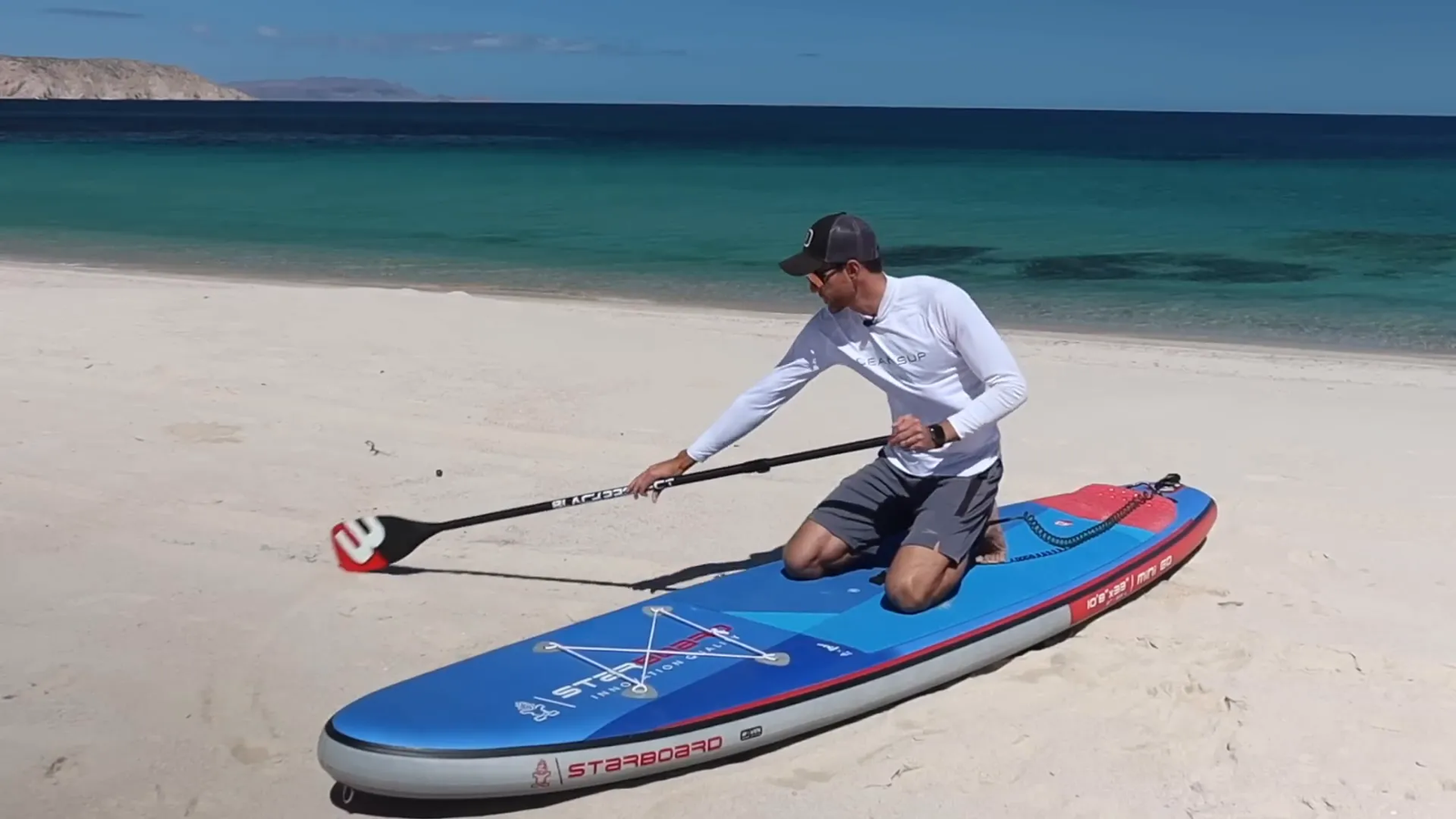 Paddler performing sweeping stroke to turn