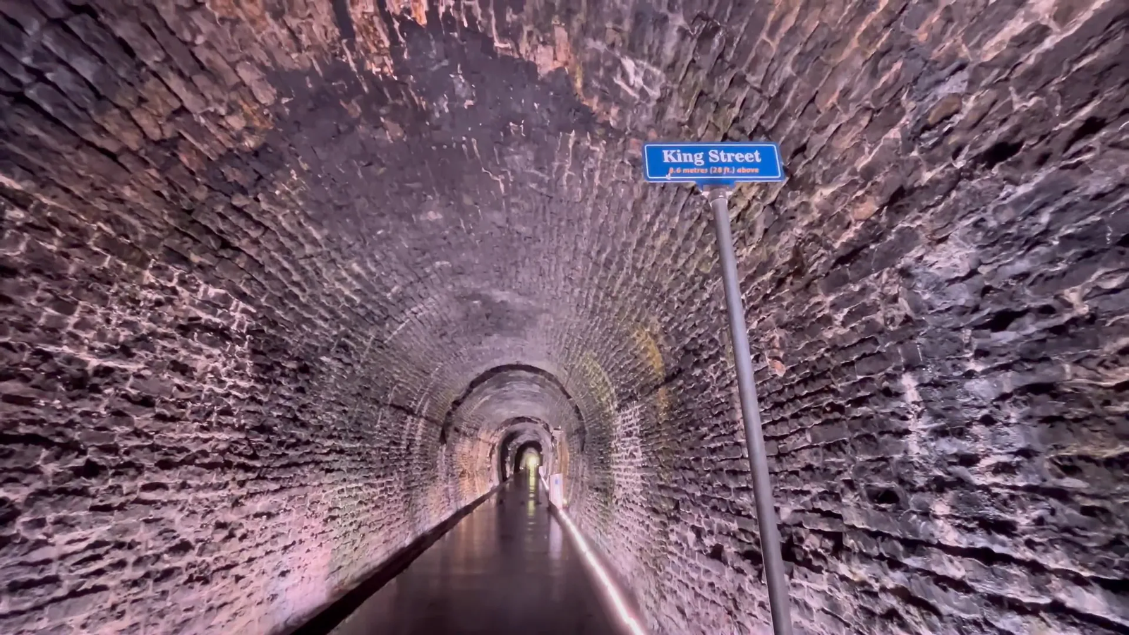 Street sign above Brockville Railway Tunnel showing King Street and elevation